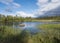 Beautiful northern landscape with river basin of Kamajokk, boulders, mountain peaks and spruce tree forest in Kvikkjokk in Swedish