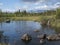 Beautiful northern landscape with river basin of Kamajokk, boulders, mountain peaks and spruce tree forest in Kvikkjokk in Swedish