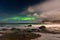 Beautiful Northern Lights in Lofoten Island in Norway. Aurora Boreal over the beach. Majestic green night sky.  Nightscape full of