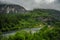 Beautiful Norway forest landscape of hills, mountain and river in a cloudy day