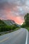 Beautiful Norwegian pink sunset over a mountain road