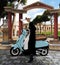 Beautiful nun riding a vespa scooter on the streets of Rome