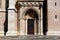 Beautiful oak wood church door and stone gate with carved stone arch.