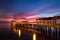 A beautiful ocean dramatic sunset and fishing pier at Jekyll Island