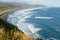 Beautiful ocean view from the edge of the cliffs on Kamchatka Peninsula, Russia. Deep blue sea water of Pacific ocean, beach with