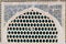 Beautiful old brick latticed window decorated with painting mosaic,Iran