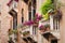 Beautiful old building balconies with colorful flowers
