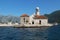 Beautiful old church on an islet in the bay in Perast,