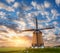 Beautiful old dutch windmill against colorful sky