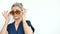 Beautiful old funny grandmother with grey hair and face with wrinkles is wearing sunglassess on white background