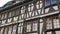 A beautiful old half-timbered building. Black carved wood on an old street