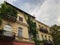 Beautiful old house partially leafy balconies on narrow street of the old city of Tbilisi, Georgia