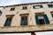 Beautiful old palace with tipical windows in the street in the old town of Dubrovnik