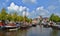 Beautiful old ships on channel. Colorful picture taken in sunny day when white clouds were on the sky.