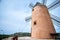 Beautiful old spain windmill against colorful sky with clouds. Spring landscape in the morning in Paguera. Rural scene