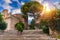 Beautiful old town of Taormina with small streets, flowers. Architecture with archs and old pavement in Taormina. Colorful narrow