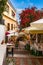 Beautiful old town of Taormina with small streets, flowers. Architecture with archs and old pavement in Taormina. Colorful narrow