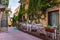 Beautiful old town of Taormina with small streets, flowers. Architecture with archs and old pavement in Taormina. Colorful narrow