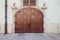 Beautiful old wooden brown door with panels in a medieval style