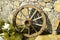 Beautiful old wooden wheel near the wall