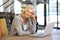 Beautiful older woman working laptop computer indoors