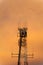 Beautiful orange sky behind the silhouette of a radio communications tower