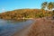 Beautiful orange sunlite beach with some boats