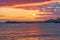 A beautiful orange sunrise bursts over the old Swanage pier