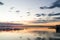 Beautiful orange sunset on one day cloudy in the famous lake of the albufera of Valencia, Spain