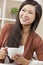 Beautiful Oriental Woman Drinking Tea or Coffee