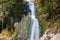Beautiful and original panorama. Beautiful and majestic landscape and panorama of a mountain waterfall, a river, in