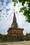 Beautiful ornamental sacred white buddhist pagoda spire landscape of Wat Chalong temple with blue sky and white cloud background