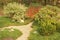 Beautiful ornamental shrubs and pea gravel path in autumn garden