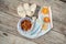 Beautiful ornate plate with a delicious orange jam on the napkin with dried oranges near the bread