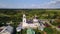 Beautiful Orthodox Church on the outskirts of the city. Aerial view.