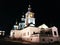 a beautiful Orthodox Church stands illuminated in total darkness