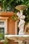 Beautiful outdoor marble fountains,boy holding a vase, vintage style