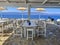 A beautiful outdoor restaurant cafe with a gorgeous view towards the Argosaronic gulf at the picuresque Greek Island of Hydra