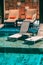 Beautiful outdoor swimming pool in hotel and resort with chair and deck for leisure vacation