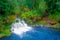 Beautiful outdoor view of long exposure of gorgeous waterfall located at Pucon, Chile