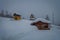 Beautiful outdoor view of many wooden houses of Lomen at Valdres Region, covered with snow during winter at Norway