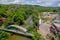 Beautiful overview of charming bridge crossing jungle river and large forest sorroundings. located in Tena, Ecuadorian