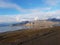 Beautiful overview photo of parts of longyear city airport with mighty mountains and sea