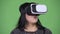 Beautiful overweight Asian woman using virtual reality headset