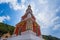 Beautiful pagoda of Thepnimit temple on high peak of Patong