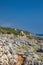 The beautiful panorama on the blue sea, from the rocky cliff of Salento.