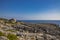 The beautiful panorama on the blue sea, from the rocky cliff of Salento.