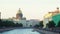 Beautiful panorama of city canal with beautiful architecture and domed Cathedral. Media. Landscape of old city with