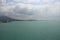 Beautiful panorama day shot of calm blue turquoise ocean water with wild islands, white sand beaches, jungle hills, light blue sky