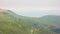 Beautiful panorama of green foggy mountains.